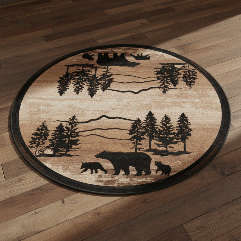 Mountain Dusk Bear Family round rug with bear, deer, and pine tree silhouettes on a hardwood floor.