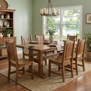 Arapaho Peak Reclaimed Barnwood Timbers Dining Table with an Antique Oak Top in a farmhouse dining room