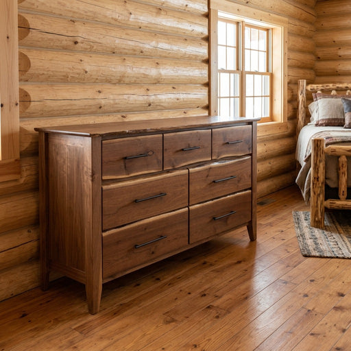 Beckwith Mountain Live Edge Walnut Seven Drawer Dresser staged in a sunlit log cabin bedroom