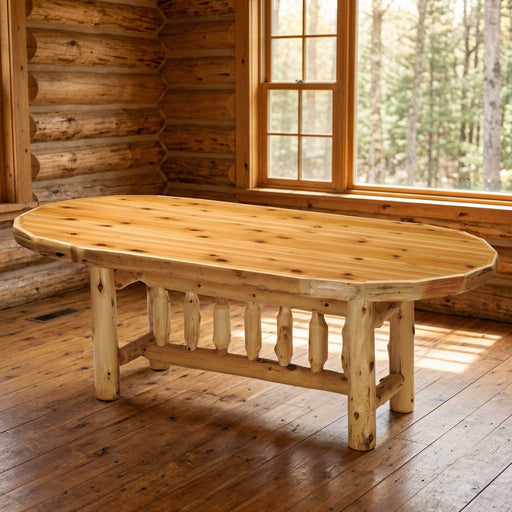 Bills Peak Cedar Log Oval Dining Table staged in a sunlit log cabin dining room