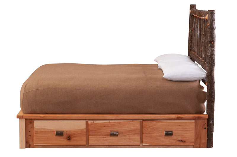 Side view of the Black Mountain Hickory Log Platform Bed Underbed Dresser under a platform bed