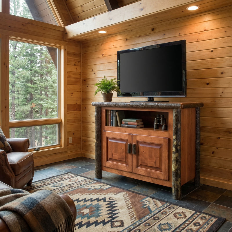 Bowen Mountain Hickory Log TV Stand in Cinnamon holding a TV in a cozy room