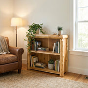 Bross Peak Cedar Log Open Bookcase in a rustic cabin living room