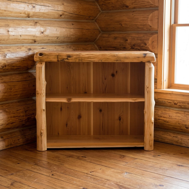 Bross Peak Cedar Log Open Bookcase staged in a sunlit log cabin living room
