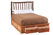 Angled view of the Buffalo Mountain Hickory Log Footboard Dresser with drawers open at the foot of the bed