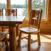 Cascade Mountain Cedar Log Cutout Dining Side Chair with a loon cutout in a lake cabin dining room