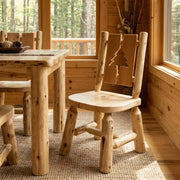 Cascade Mountain Cedar Log Cutout Dining Side Chair with a pine tree cutout in a cabin dining room