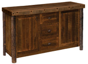 Angled view of the Chief Mountain Barnwood and Hickory Sideboard showing hickory log legs