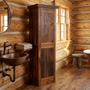 Clover Mountain Reclaimed Barnwood Linen Cabinet staged in a sunlit log cabin bathroom