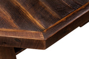 Close-up of the Comanche Peak Reclaimed Barnwood Octagon Coffee Table edge and leg joinery