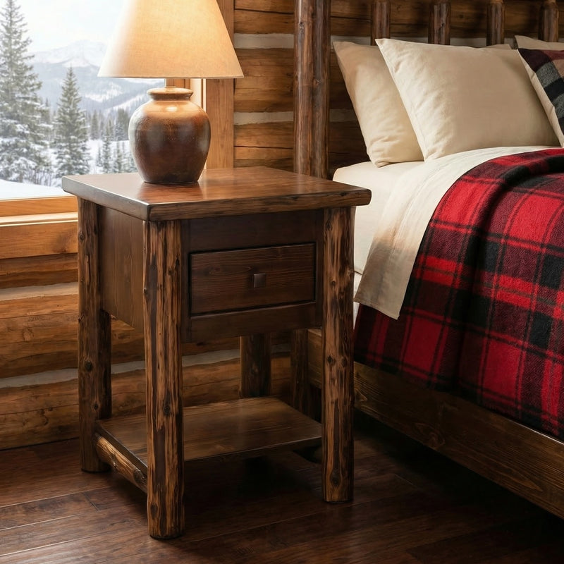 Cooper Peak Cedar Log Nightstand with Drawer and Shelf beside a bed in a rustic cabin bedroom