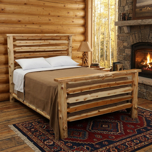 Crestone Peak Cedar Log Bed staged in a pine log lodge bedroom with stone fireplace, aspen window view, and wool rug