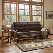 Crystal Peak Hickory Log Futon with a patterned cover in a living room with a large window and area rug