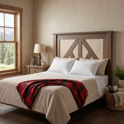Cuerno Verde Pine Cottage Headboard behind a bed with a red throw in a cabin bedroom