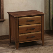 Cumberland Peak Live Edge Walnut Three Drawer Nightstand beside a bed in a cabin bedroom