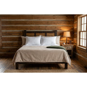 East Spanish Peak Pine Cider House Headboard staged against a log wall in a farmhouse cabin bedroom