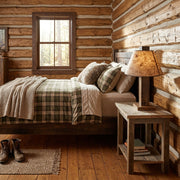 Elk Mountain Reclaimed Barnwood Table Lamp staged in a sunlit log cabin bedroom