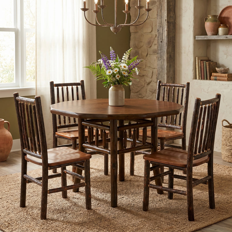 Engineer Mountain Hickory Log Round Dining Table in Natural in a bright cabin dining room