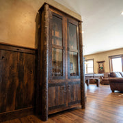 Fairview Peak Barnwood and Hickory Eight Gun Cabinet in a bright cabin room