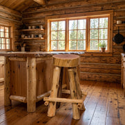 Fuller Peak Cedar Slab Stool with Outside Footrests staged in a sunlit log cabin kitchen