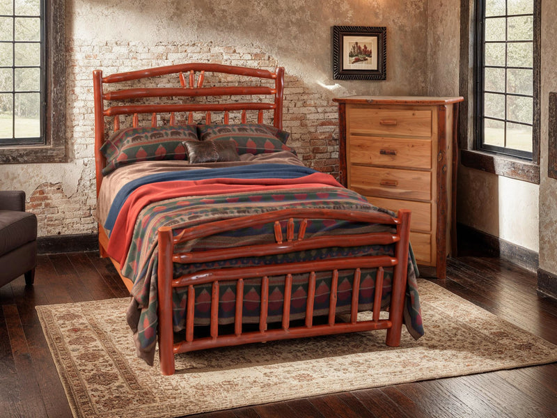 Gibbs Peak Hickory Log Chest of Drawers beside a hickory log bed with a southwestern bedspread in a cabin bedroom