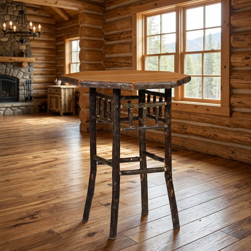 Greenhorn Mountain Hickory Log Round Pub Table staged in a sunlit log cabin dining room