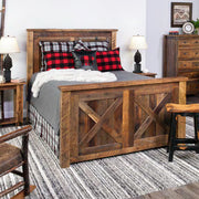 Hanging Lake Barnwood Barn Door Bed with red buffalo check pillows in a farmhouse bedroom with a striped rug
