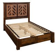 Angled view of the Hassell Peak Reclaimed Barnwood Chevron Bed with Rail System showing the rail system and slats