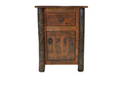 Angled view of the Horseshoe Mountain Barnwood and Hickory Enclosed Nightstand showing the drawer over a cabinet door between hickory log posts