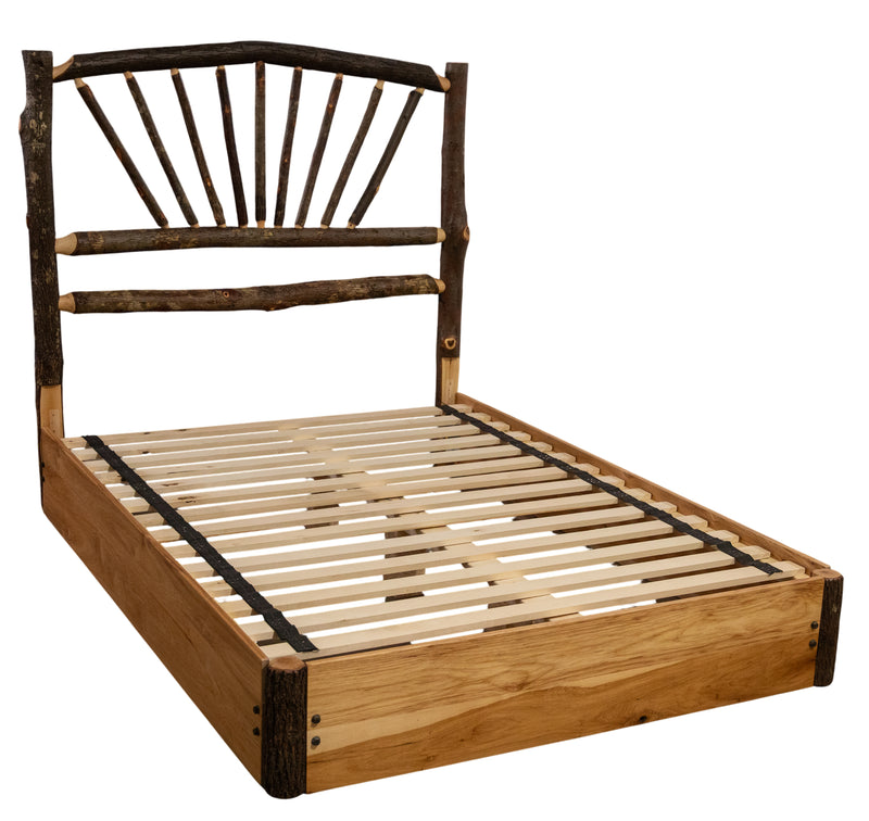 Angled view of the Huron Peak Hickory Sunburst Platform Bed showing the hickory sunburst headboard and slatted platform