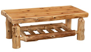 Angled view of the Isolation Peak Cedar Log Rectangle Coffee Table showing the cedar top and slatted shelf