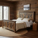 Jackson reclaimed barnwood bed in a rustic mountain cabin bedroom with wood walls, hardwood floors, and natural light