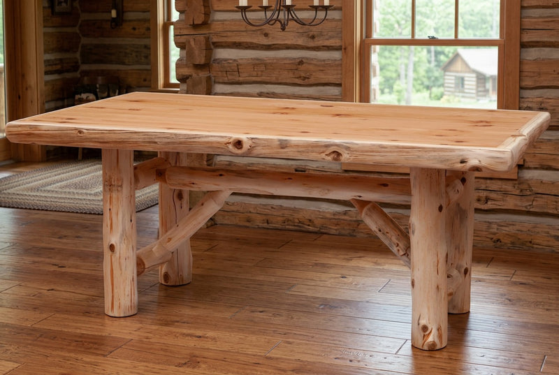 Kataka Mountain Cedar Log Trestle Dining Table staged in a sunlit log cabin dining room