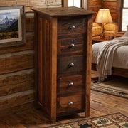Kelso Mountain Reclaimed Barnwood Lingerie Chest beside a framed mountain print in a lamp-lit log cabin bedroom