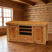 Kendall Mountain Cedar Log Entertainment Center staged in a sunlit log cabin living room