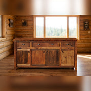 Kenosha Peak Reclaimed Barnwood Long Buffet staged in a sunlit log cabin dining room
