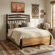 Lavender Peak Hickory Wagon Wheel Bed with Rail System with layered bedding in a cozy bedroom