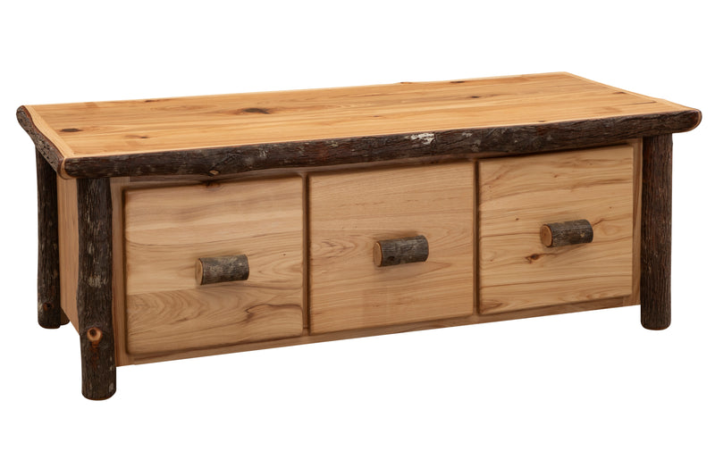 Angled view of the Lone Cone Hickory Log Three Drawer Coffee Table showing three drawers between hickory log posts