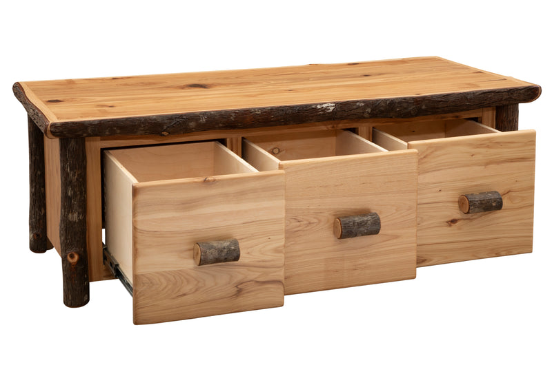 Angled view of the Lone Cone Hickory Log Three Drawer Coffee Table with three dovetailed drawers open