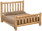 Angled view of the Longs Peak Cedar Log Bed with log spindle headboard and footboard