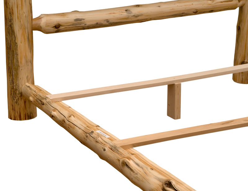 Detail view of the Longs Peak Cedar Log Bed three-quarter log side rail and slats