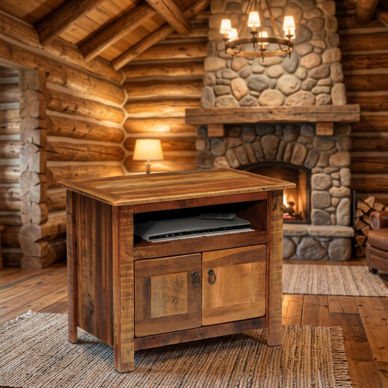 Lulu Mountain Reclaimed Barnwood TV Stand in a log cabin living room with a stone fireplace