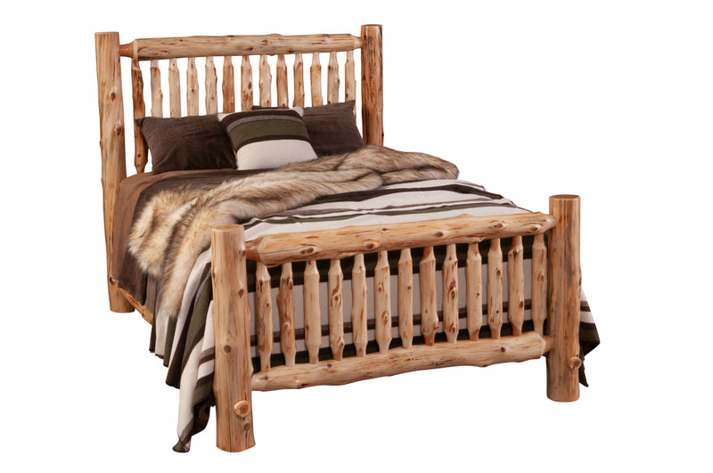 Angled view of the Maroon Bells Cedar Log Spindle Bed styled with striped wool bedding and fur throw