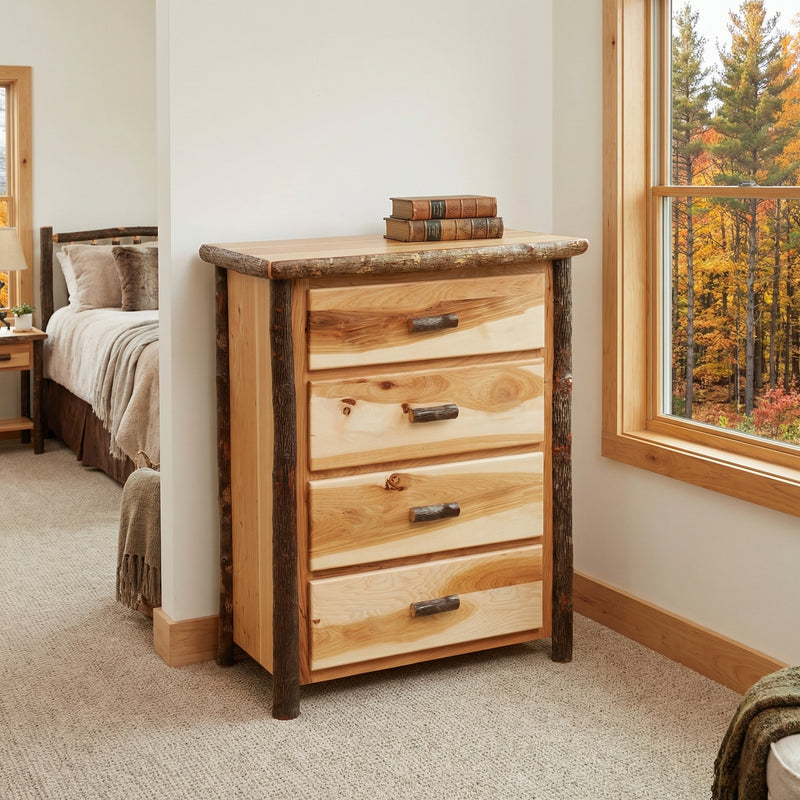 Matterhorn Peak Hickory Log Chest of Drawers in Natural beside a bed near a window with autumn trees