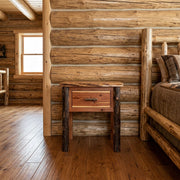 McGregor Mountain Hickory Log One Drawer Nightstand staged in a sunlit log cabin bedroom