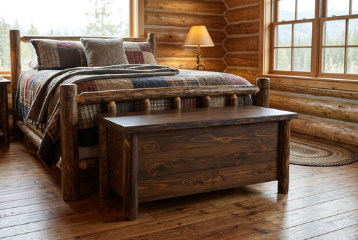 McHenrys Peak Cedar Log Blanket Chest staged in a sunlit log cabin bedroom