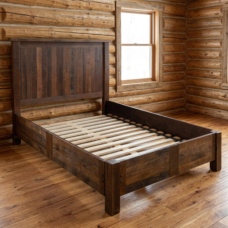 Medano Peak Reclaimed Barnwood Panel Bed with Rail System staged in a sunlit log cabin bedroom