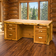 Mount Adams Cedar Log Executive Desk staged in a sunlit log cabin home office