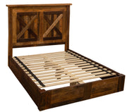 Angled view of the Mount Antero Barnwood Barn Door Platform Bed showing the barn door X-brace headboard and slatted platform