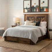 Mount Antero Barnwood Barn Door Platform Bed with gray bedding below mountain wall art in a white shiplap farmhouse bedroom
